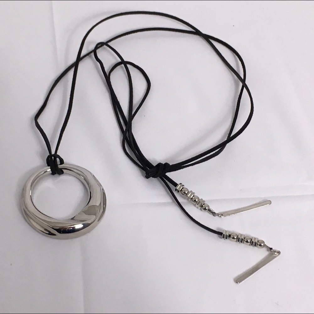 Free with purchase over $15 / silvertone pendant